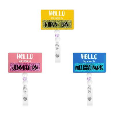 China Portable Custom Badge Reels with Glitter Name ID Holders for Badges Nurses Work Decorative Badge Holders for sale