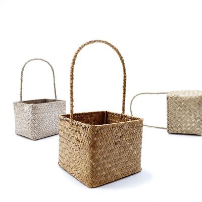 China Sustainable Wholesale Price Straw Weaving Handmade Woven Basket For Home Flowers for sale