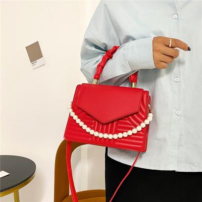 China 2022 New PORTABLE Retro Personality Pearl Messenger Bag Candy Color Women Shoulder Bags Women Handbags for sale