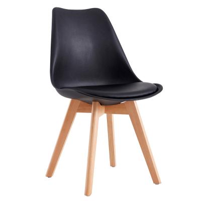 China Contemporary Modern Plastic Tulip Fancy Nordic Fashionable Design Shell Dining Cushion Seat Black pp Plastic Dining Chairs With Wooden Legs for sale