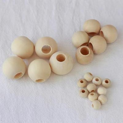 China DIY 10-40mm Big Hole Wooden Beads Natural Round 20mm Wooden Ball For DIY Craft Jewelry Accessories Lost Ball Beads for sale