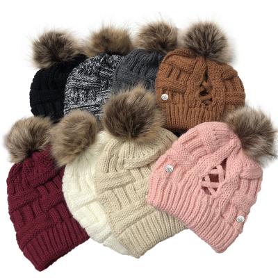 China JOINT Warm Button Mask Hanging Lattice Hat Large Crimped Winter Knitted Ponytail Hat Women Beanie Pom Pom Hats for sale