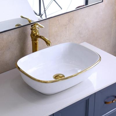 China New Pattern Fashion Elegant Art Gold Plated Gold Basin Ceramic Bathroom Sink Bathroom Sink for sale