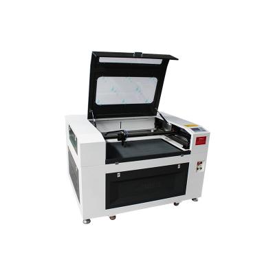 China Programmable multifunctional laser engraving machine laser cutting machine 9060 reci 60/80/100W for wood fabric photo leather pictures for sale