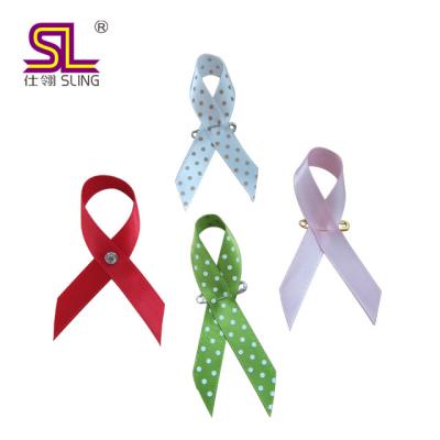 China Charity Ribbon Bow Product Sustainable Pink Material 100%polyester Awareness Ribbon With Pin for sale