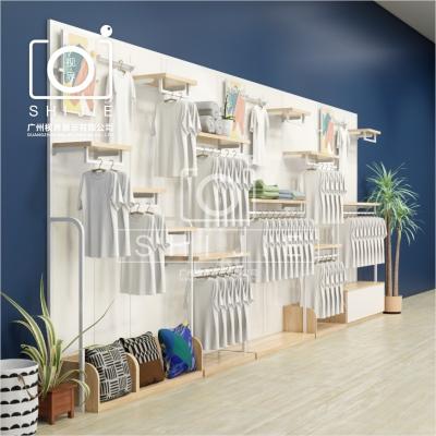 China custom clothing display racks for kid boutique wholesale shelves stand for store clothing shelf rack hanger rack fitting shelves for store maternity design for sale