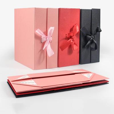 China Recycled Materials FocusBox Cardboard Paper Custom Pink Favor Boxes Wedding Magnetic Gift Box Packaging With Ribbon Closure for sale