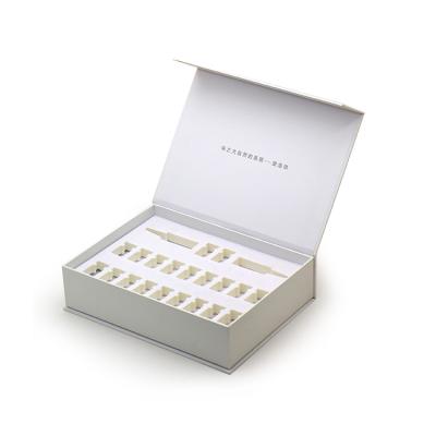 China Recycled FocusBox Materials Essential Oil Bottle Custom Paper Packaging White Magnetic Cosmetics Gift Box With Logo for sale