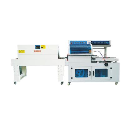 China CLOTHING China Upack Automatic Cling Film Shrink Tunnel Heat Wrapping Machine For Boxes Boxes Bags Book for sale