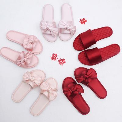 China Hot Sale Fashion Trend Women's Bride Bridesmaid Slippers Wedding Gift Bow Sandals Silk Satin Slippers For Women for sale