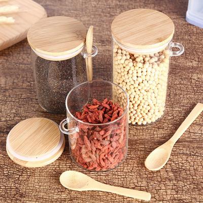 China Eco-friendly Clear Borosilicate Freshness Preservation OEM Feature 800ml 1000ml 1200ml Food Storage Glass Jar With Bamboo Spoon for sale