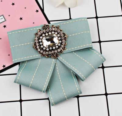 China Wholesale Chic Ribbon Brooches Fashionable 3D Bow Tie Brooch For Decoration for sale