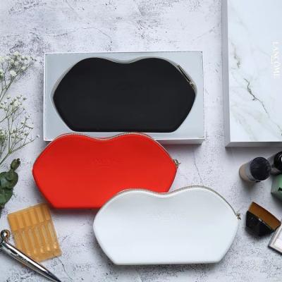 China Fashion Lip Shape Silicone Waterproof Soft Travel Makeup Toiletry Bag Cosmetic Wash Pouch For Woman for sale