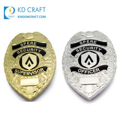 China custom manufacturer 3D metal embossed logo 3d gold enamel silver plating safety badge with safety pin for sale