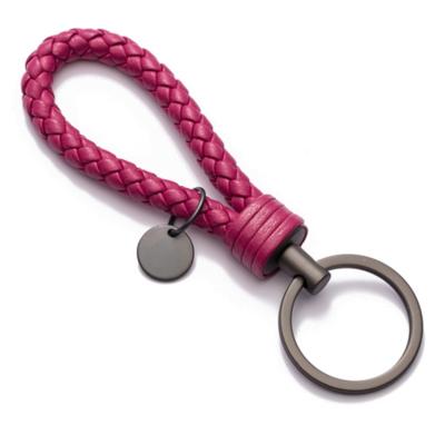 China Handmade woven genuine leather key chain car key chain custom metal red leather car keychain for sale