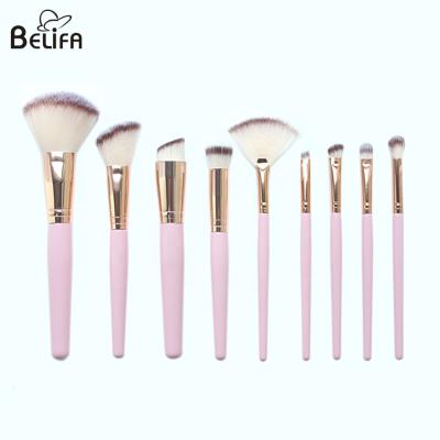 China Belifa new products customized vegan synthetic hair pink wood handle 9 piece rose gold makeup brush set en venta