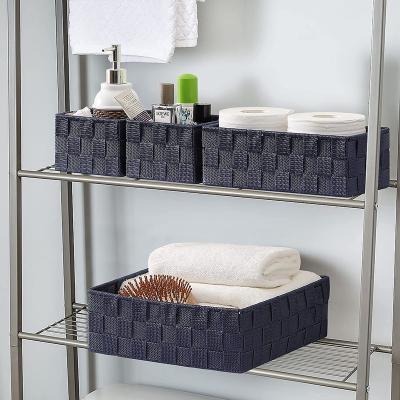 China Viable factory direct decorative woven strap set of 4 interlocking baskets, bathroom countertop storage bins, for sale