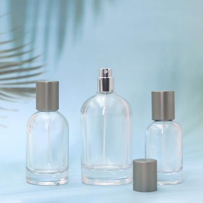 China 30ML50ML100ml Cosmetic Custom Round Perfume Bottle 30ml 50ml 100ml Empty Perfume Bottle for sale