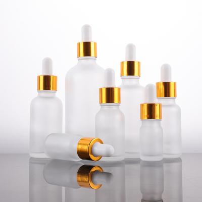 China Custom logo 5ml 10ml 15ml 20ml 30ml 50ml 100ml cosmetic dropper clear frosted glass bottles with gold ring for sale