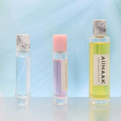 China 50ml 100ml Cosmetic Cylindrical Clear Perfume Bottle With Custom Resin-covered Empty Perfume Bottle for sale