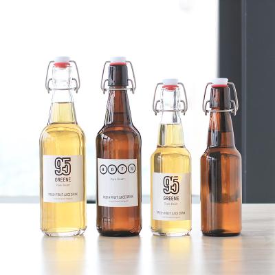 China Custom Clear Beverage Label 330ml 500ml 1000ml Flip Swing Top Empty Glass Beer Bottle With Wire Easy Swing Cap for sale