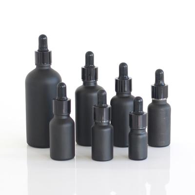 China 5ml 10ml 15ml 20ml 30ml 50ml 100ml cosmetic black frosted glass essential oil serum dropper bottle with cap paper tube for sale