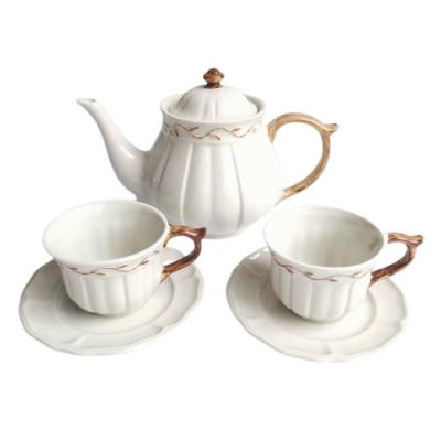 China New Viable Personalized Antique White Color Embossed Teapot Sets Tea Cup And Saucer Ceramic Coffee Pot Sets for sale