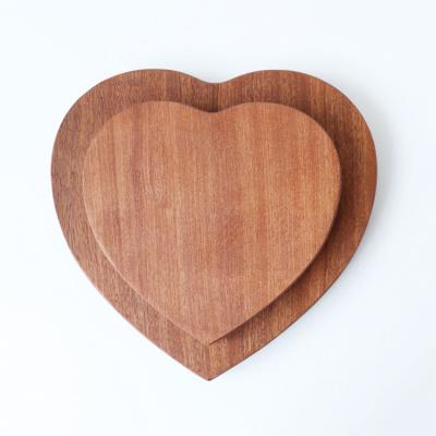 China Viable Custom Rustic Logo Engrave Unique Kitchen Natural Ebony Wooden Heart Shaped Cutting Board for sale