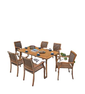 China Modern hot sales rattan wicker chairs and long table for dining high quality coffee tea time furniture rustproof waterproof for sale