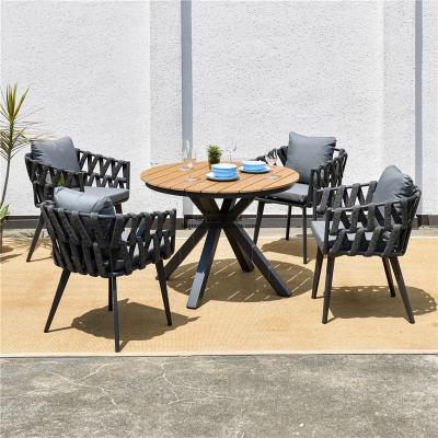 China 2035 Teak Wood Color Modern Aluminum Plastic Wood Round Tables Set Webbing Wicker Chair Rattan Rope Outdoor Furniture 1+4 for sale