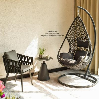 China Milla Oval Rope Strap Round Table Aluminum Swing Basket Chair Modern Hanging Wicker Egg Shape Leisure Chair Garden Patio for sale