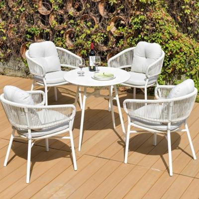 China Modern Outdoor Patio Furniture Set Rattan Wicker Chair Handcrafted White Color Tables Modern Design Waterproof Chair for sale