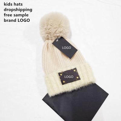 China JOINT Free Samples Wholesale Brand Custom LOGO New Winter Boy Girls Wool Hat Warm Wool Knit Hat Knitted Pom Pom Beanie for sale