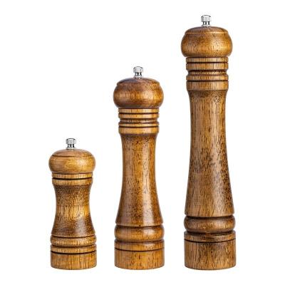 China Durable Retro Light Luxury Ceramic Spice Bench Grinders Salt Grinder Machine Wooden Pepper Mill for sale