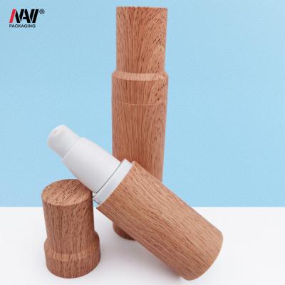 China Cosmetic lastic airless pump bottle for cosmetic bottle 35ml 50ml bamboo airless airless pump bottle with bamboo stepped cap for sale