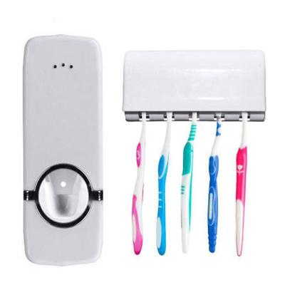 China Viable Wholesale Automatic Wall Mounted Toothpaste Dispenser With Toothbrush Holder And Pump Rolling Automatic Squeezer Kit Bathroom Set for sale