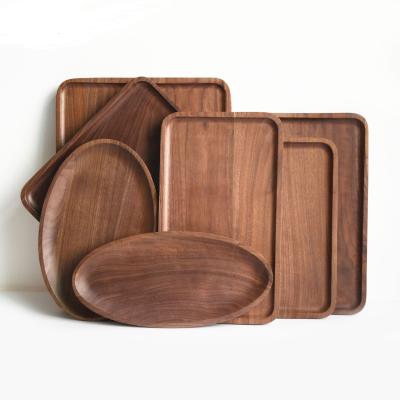 China Hotel Restaurant Wooden Handle Hand Dish Tray North American Black Walnut Disposable Creative Wooden Fruit Pizza Dish for sale