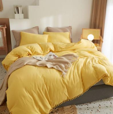 China Non-Toxic Yellow Pompom Bedding Sheet Sets With Cozy Ball Microfiber Fabric Washed Decorative Queen King Duvet Cover Pillowcase for sale