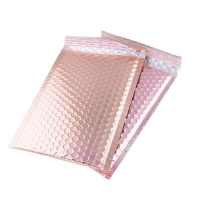 China Rose Gold Holographic Bubble Mailer Strong Adhesive Apparel Mailing Bags for sale