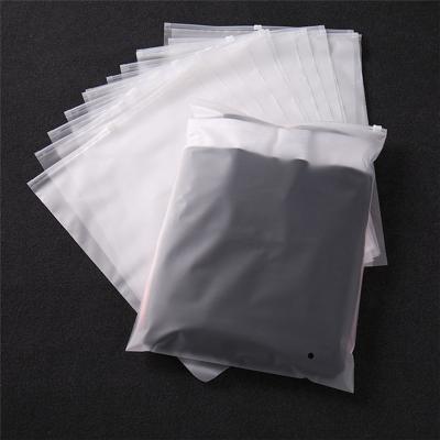 China Garment Package Zip Lock Moisture Proof Frosted Plastic Bag Clothes Packaging Bags With Custom Logo for sale