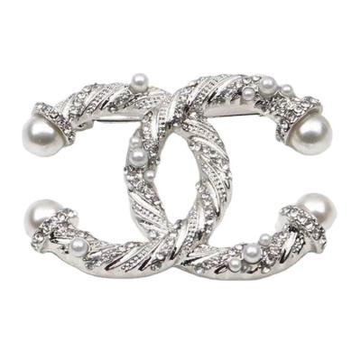 China Wholesale European and American Style Elegant Women's Letter c Brooch Pretty With Zircon Crystal Pearl Pin Quality Brooch All-match Clothing Access For Ladies for sale