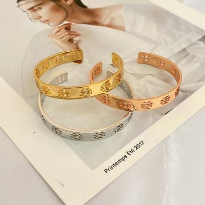 China Fashion CLASSIC Wholesale Ladies Hollow Out Stainless Steel Personal Open Jewelry Bangle Hammered Gold Flat Bracelets For Women for sale