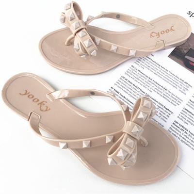 China Anti-slippery USA Fashion Large Size Jelly Women's Flip Flops Rivet Beach Slippers Womens Late Summer Shoes PVC Shoes For Girl And Ladies for sale