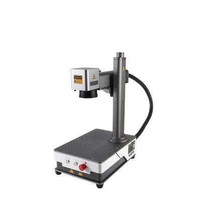 China 20W Portable Fiber Laser Marking Machine With Rotary Complimentary Worktable Rotating Head and Fixture Water Cooling 's for sale