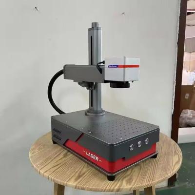 China 20KG Metal Engraving Machine Portable 20w 30w 50w Mopa Gold Smart Color Fiber Laser Marking Machine with Portable Design for sale