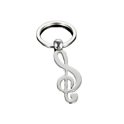 China Classic personality small note bag small note personality keychain chic music car jewelry gift accessories men and women stainless steel keychain for sale