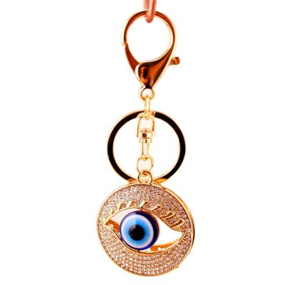 China Trendy Unisex Car Fashion Women Charms Handbag Dangle Key Chains Crystal Evil Eye Key Ring for sale