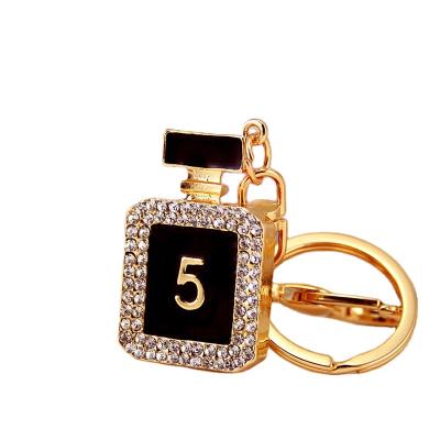 China Fashionable Rhinestone Black Color Perfume Bottle Shape Gifts Car Handbag Key Pendant Key Chain Holder for sale