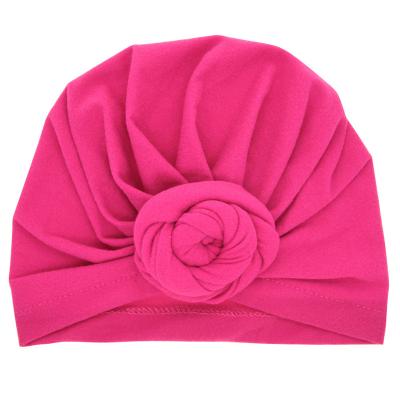 China Newborn Elastic Baby Beanie Multicolor Infant Turban Hats Plush Donut Baby Hat Cotton for sale