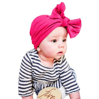 China 2021 New Plush Baby Beanies Hat Knitted Cotton Tire Bow Newborn Kids Accessories Popular Boy Hats for sale